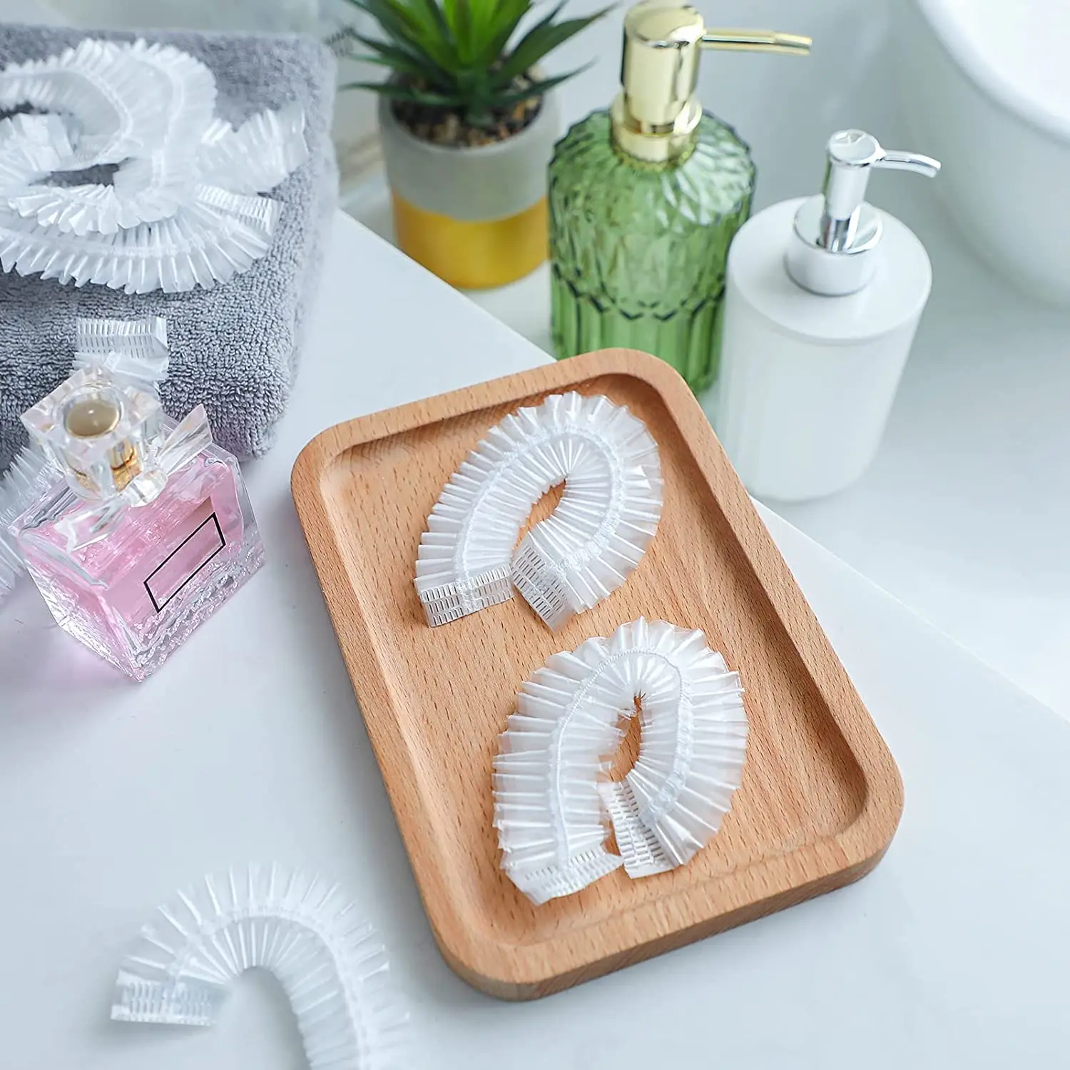 100pcs Disposable Earmuff Cover Waterproof  Plastic Shower Hat Earear shower caps