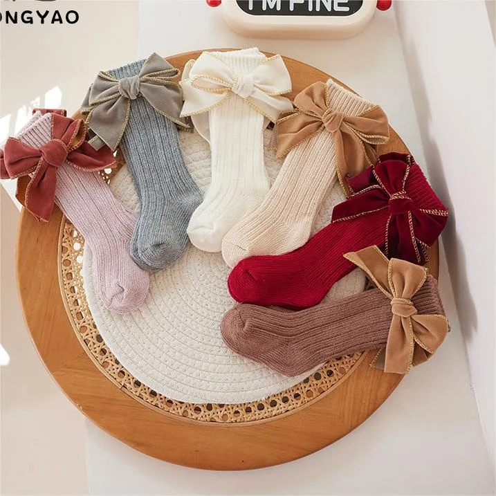 Autumn and winter baby girl fashion thick needle cotton socks solid color sweet bow princess style high socks