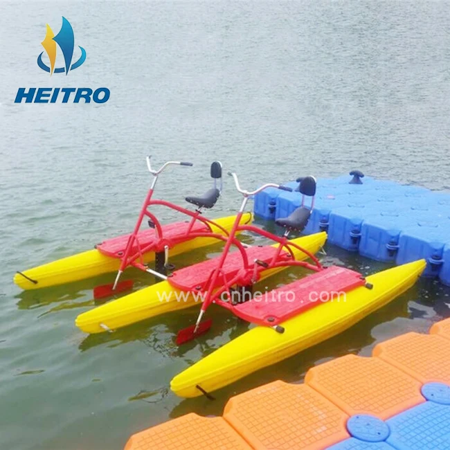 floating boat able to cycle on water mounted on two floats, recreational and competitive activity using water bike