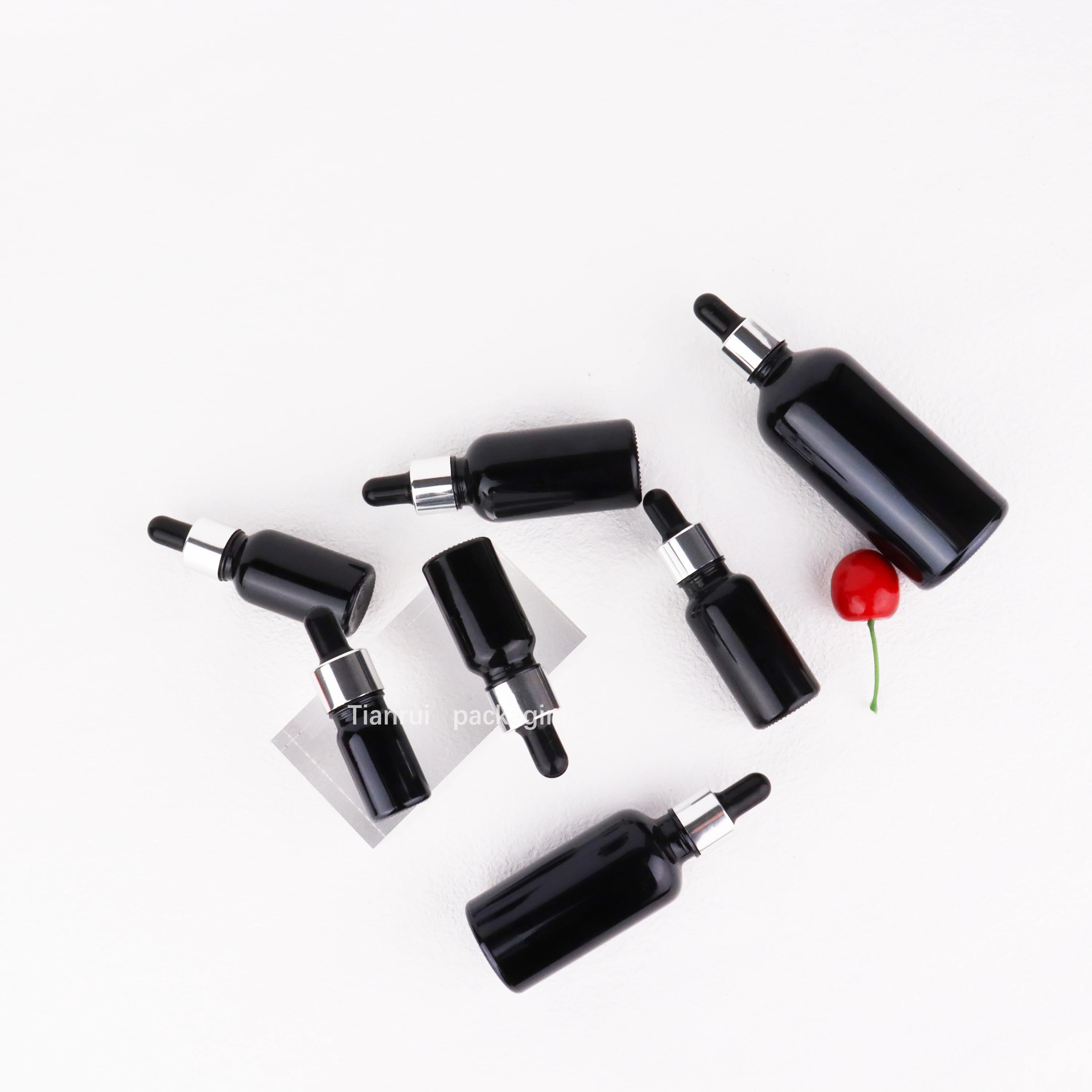 Custom 5ml 10ml 15 ml 20ml 30ml 50ml 100 ml UV Proof Black Essential Oil Glass Dropper Bottle with Sliver Lid in Bulk