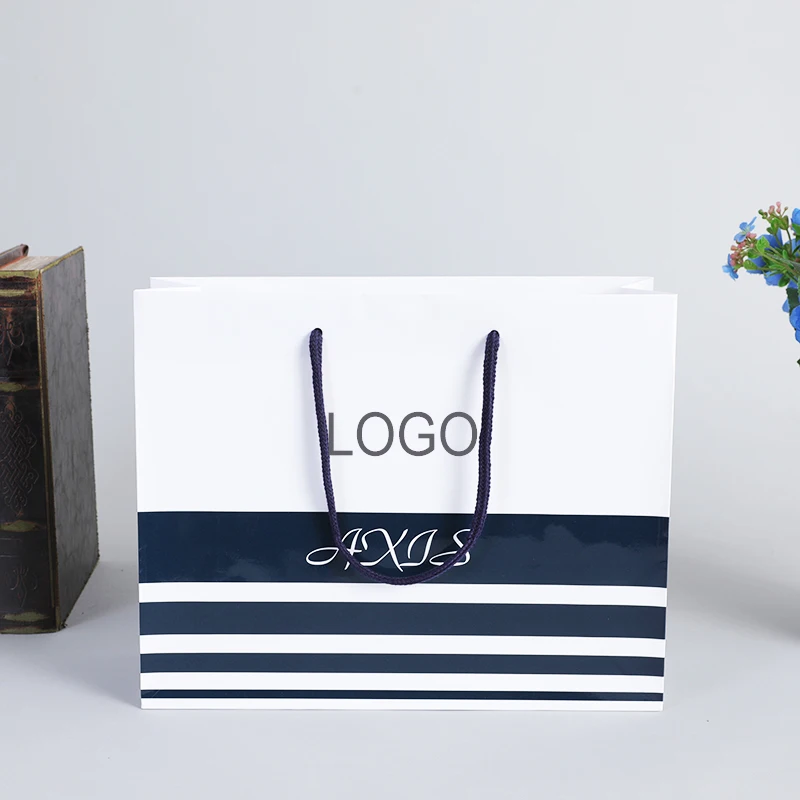 Custom stripe shopping bags luxe pour vetements luxury take away packaging paper bag for small businesses with your own logo