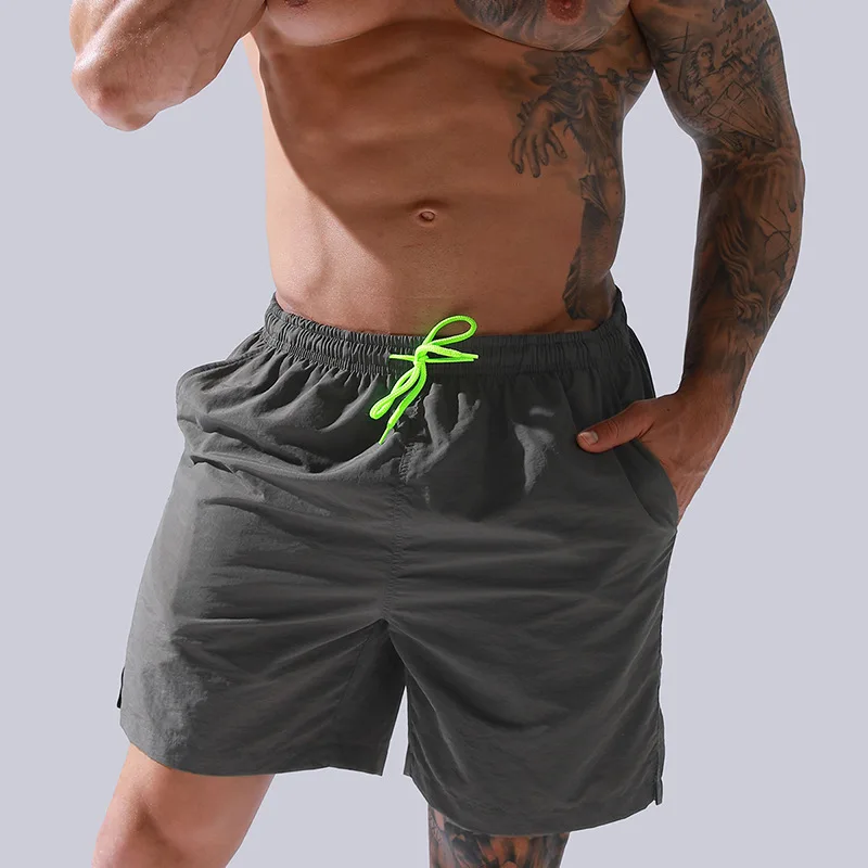 wholesale men pants summer sports shorts loose fit quick dry polyester board shorts male swim trunks beach shorts with pockets