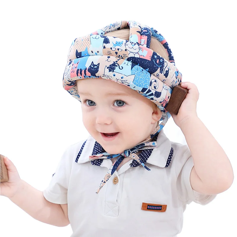 Baby protection hat for falling head A baby walks with a crash helmet Child safety helmet