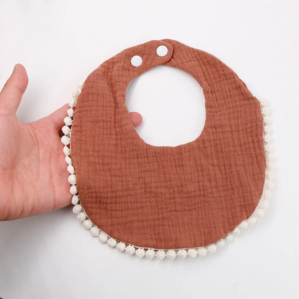 Yiwu Yiyuan Garment custom 100% cotton Pink Circular Baby Bib with White Pom-poms