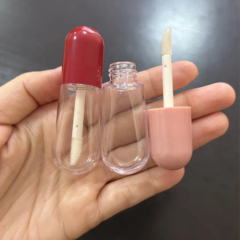 Hot sale pill shaped mini cute lipgloss tubes pink red custom logo empty lip gloss containers clear bottle with brush 4ml