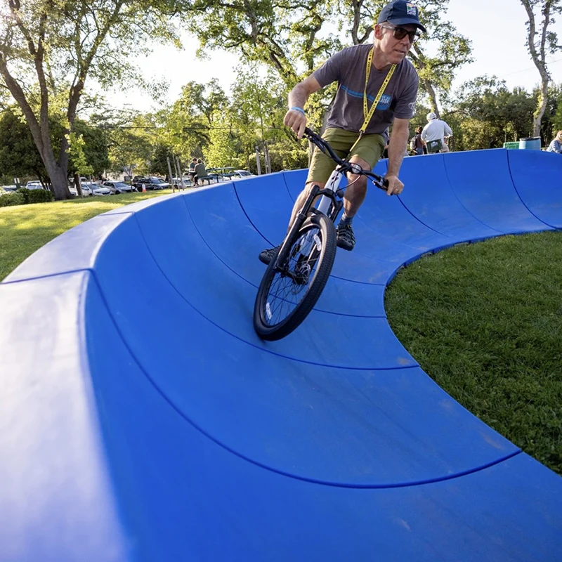 Plastic Modular Pump Track Velocity Loop 2 Is a Sequence of Roll Overs and Berms for Bikes BMX Scooters Skateboards