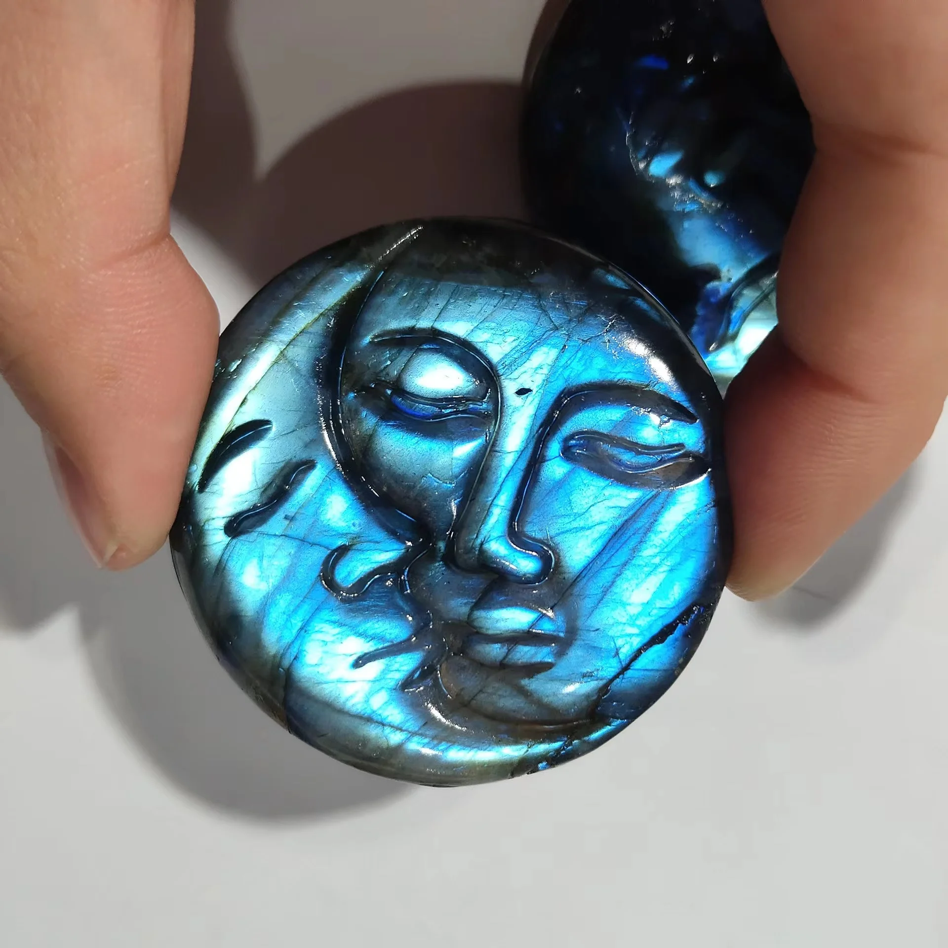 Wholesale Natural Strong Flash Blue Light Labradorite Crystal Carving Sun And Moon Palm