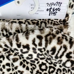 China cheap custom 100% Polyester lining leopard print short hair jacquard knitting fake fur fabric for clothes