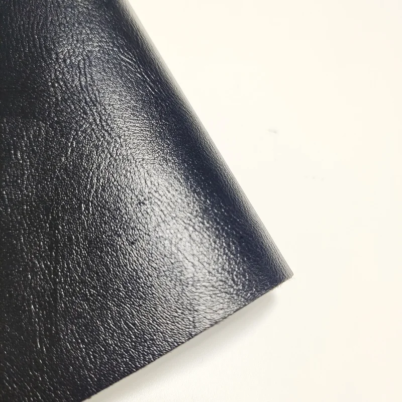 Black 0.9MM thick high-quality smooth fine sheepskin pattern PU synthetic leather fabric used for handbag, car seat material