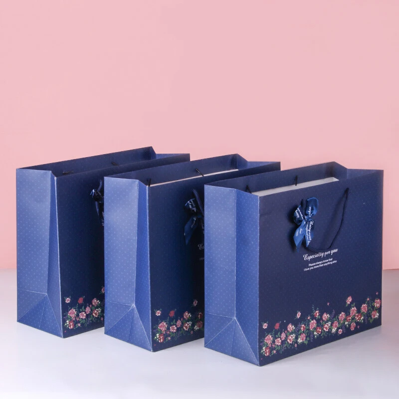 Luxury brand custom logo gift paper bag for clothes blue matte garment clothing boutique packaging bags with ribbon bow