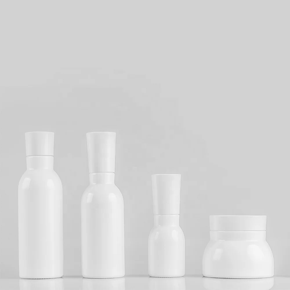 Blue glass bottle with pump and silver cap for lotion and serum