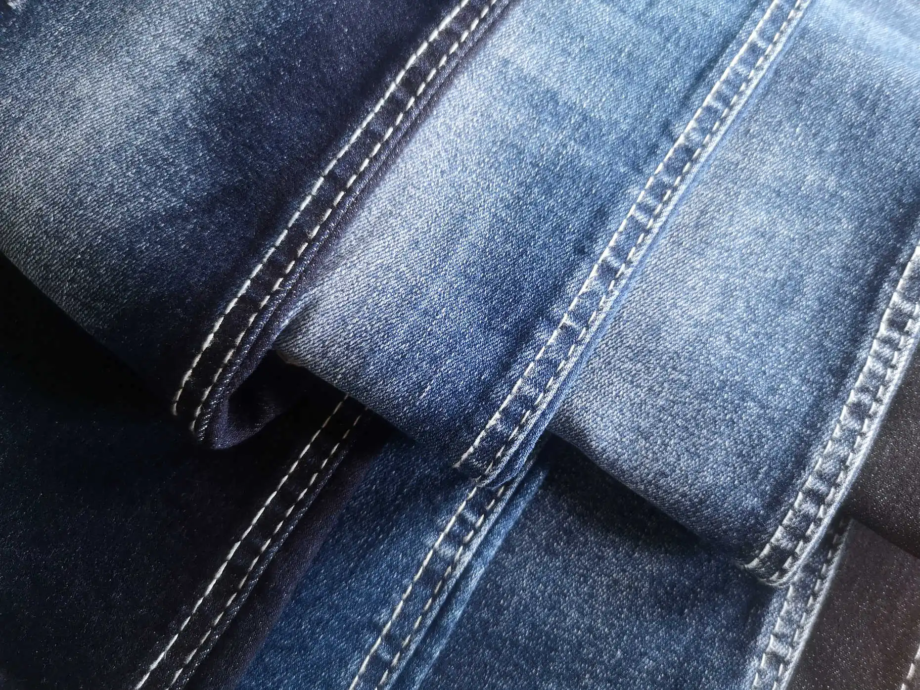 2549 Soft OE Foshan denim manufacturer raw material bull woven twill high stretch denim fabric for shiny jeans