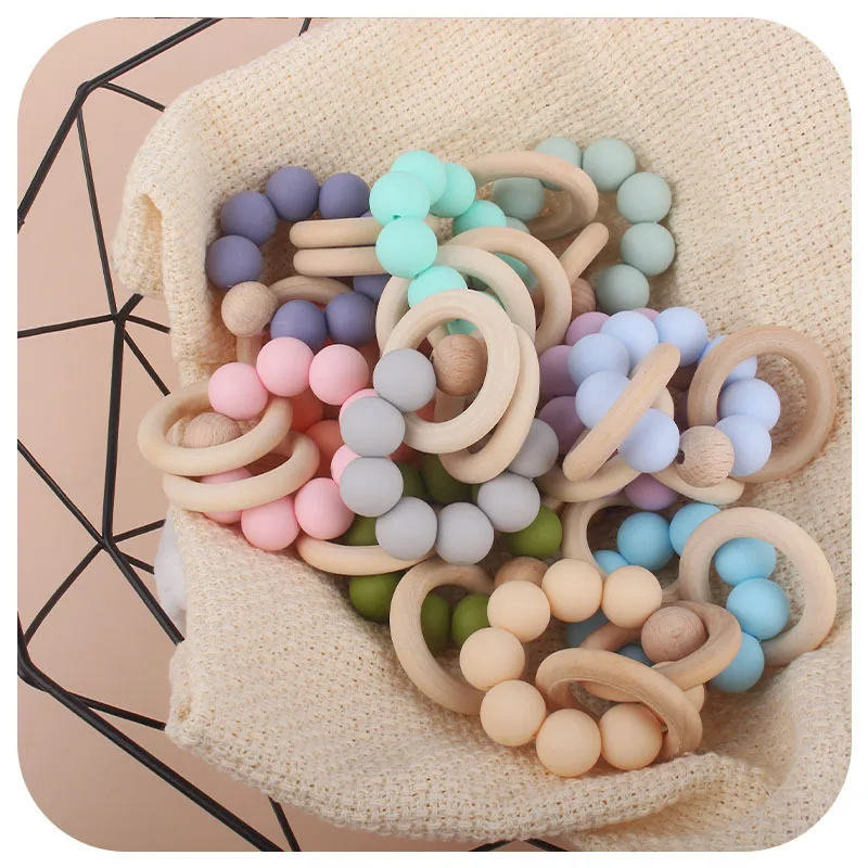 Hot Sell Silicone Beads Anneau Dentition Diy Baby Silicone Rattle Wrist Ball Teether Ring Wooden Binky Toys Newborn Babi gift