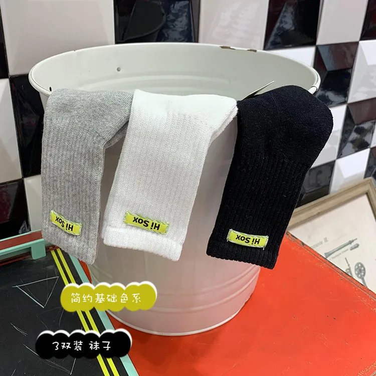 Hot selling cotton children long socks custom logo fashion comfortable school black white grey kids with phrases terry socks