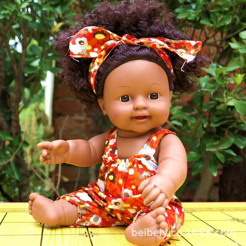 A 30 cm African doll with an afro head that speaks vocally