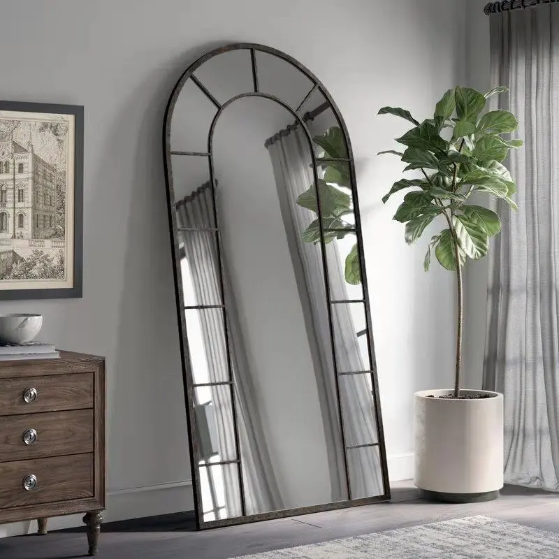 large arched full-length metal floor standing dressing mirror