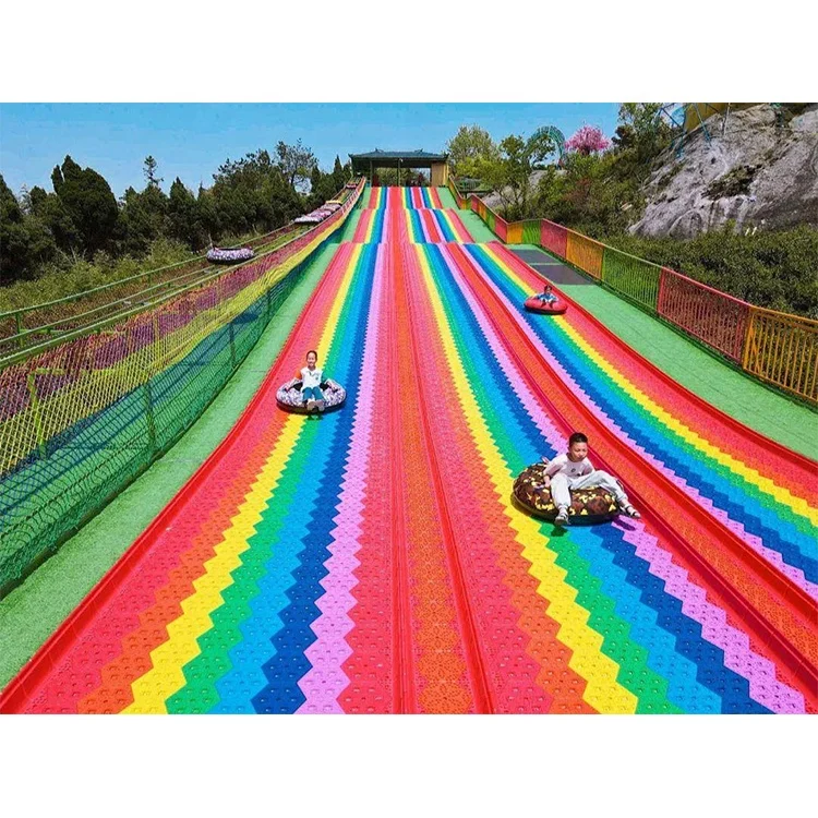 Commercial Rainbow Slide Artificial Ski Grass Turf Surface Donut Slide Ride Dry Slide Slope For Adult