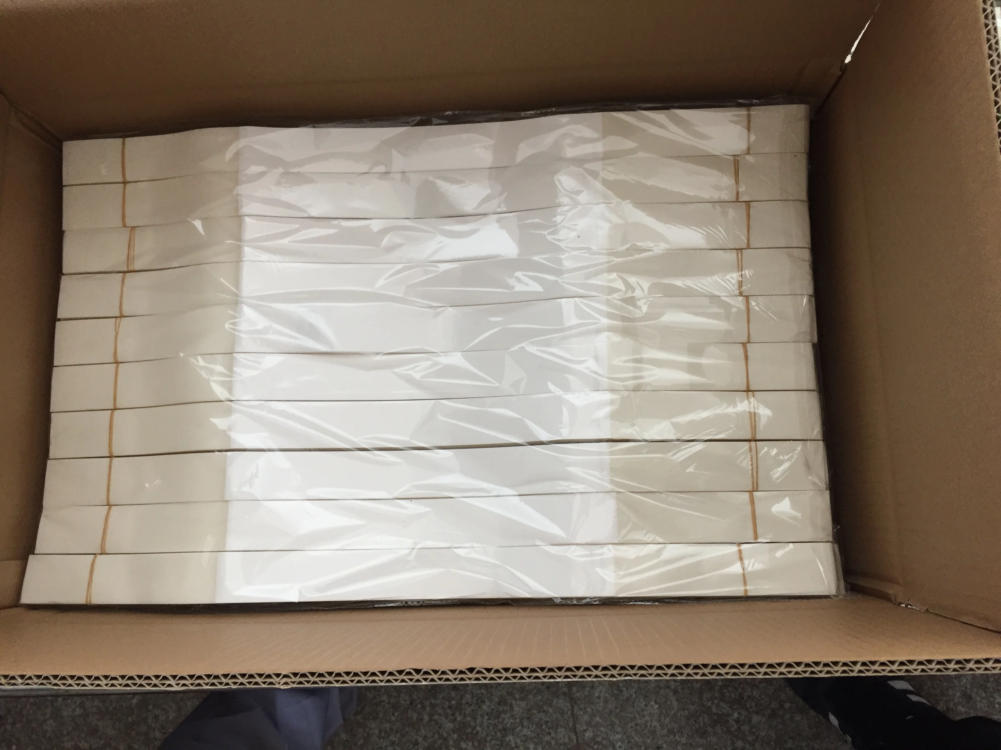 sturdy white plastic strips with high tack adhesive on each end are convenient for all packages packed 25 pieces per PE bags