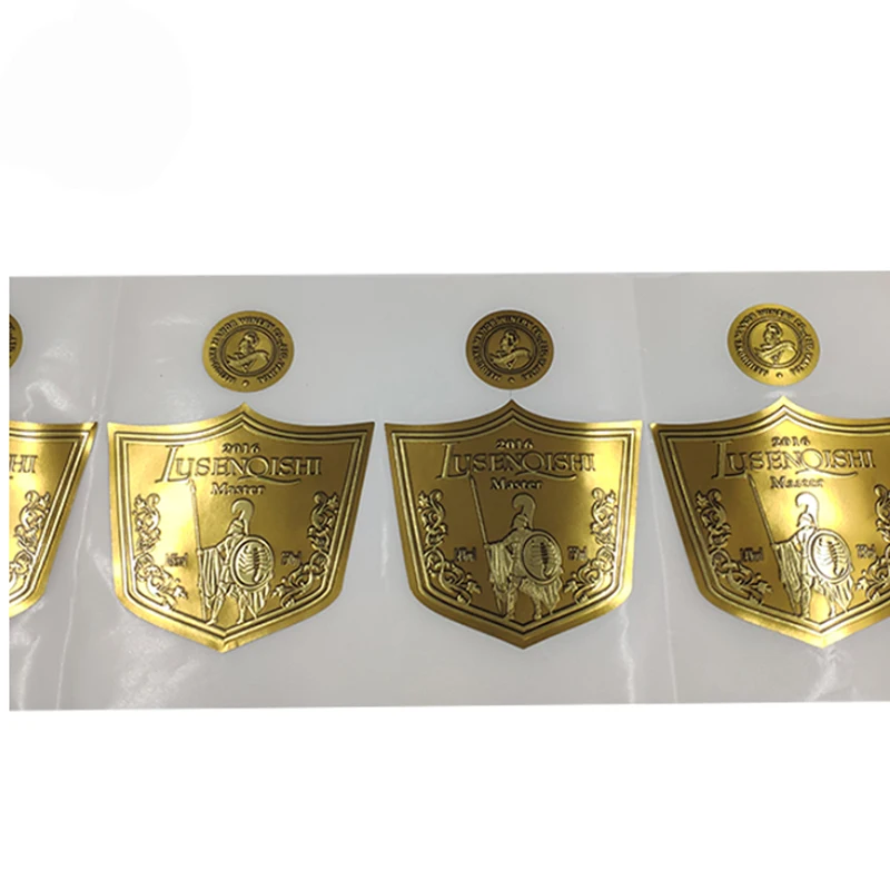 Custom luxury embossed gold foil embossed logo sticker adhesive label china manufacturer