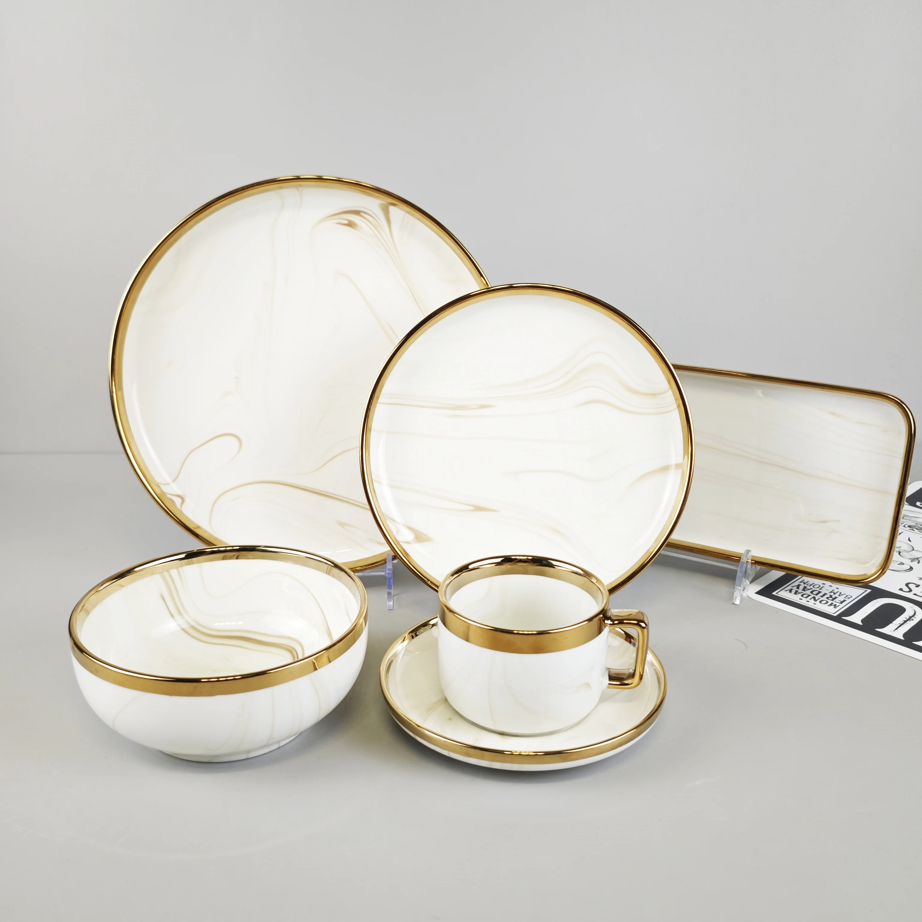 Wholesale light luxury Nordic style yellow glazed marble dinnerware set gold-rimmed porcelain wedding tableware