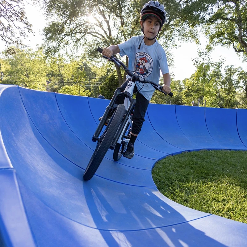Plastic Modular Pump Track Velocity Loop 2 Is a Sequence of Roll Overs and Berms for Bikes BMX Scooters Skateboards