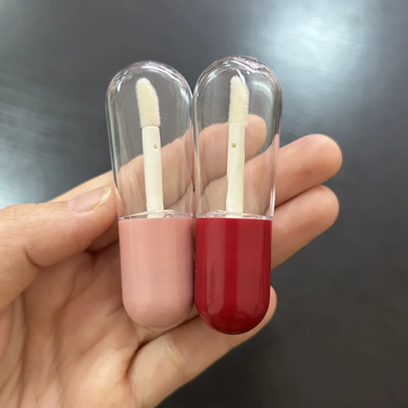Hot sale pill shaped mini cute lipgloss tubes pink red custom logo empty lip gloss containers clear bottle with brush 4ml