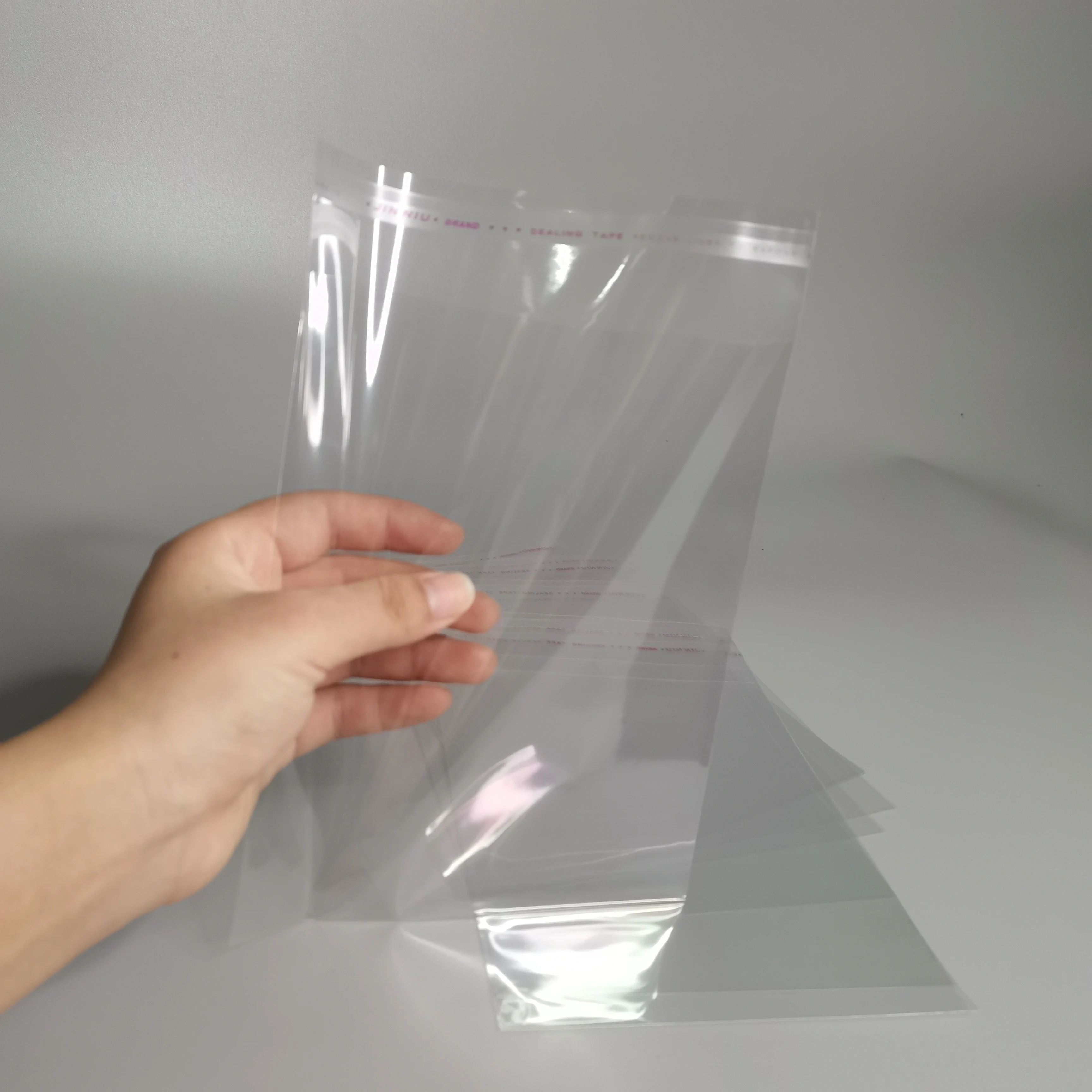 Custom Logo Printed Clear Plastic PET Cellophane Bags Resealable Apparel Packaging Adhesive Self-Sealing Opp Transparent Bag