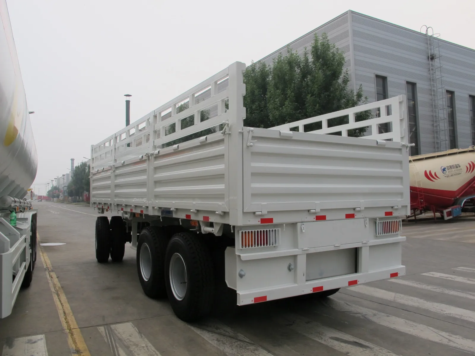 Hot selling high quality 3 Axle Draw Bar Fence Full Trailer 40-100 tons Drawbar Towing Dolly Full Truck Trailer With Fence Stake