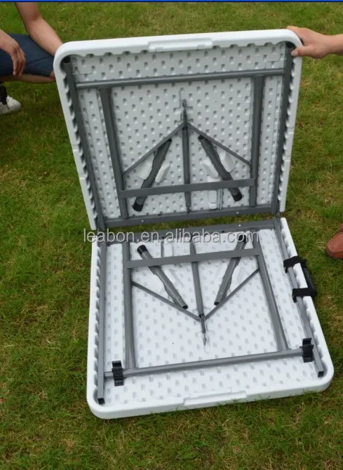 Rectangular portable folding plastic table for indoor and outdoor uses