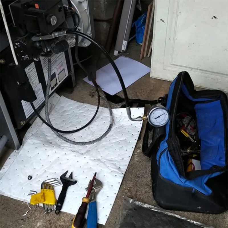 Perforated petroleum absorbent sheet for ocean oil spill cleanup