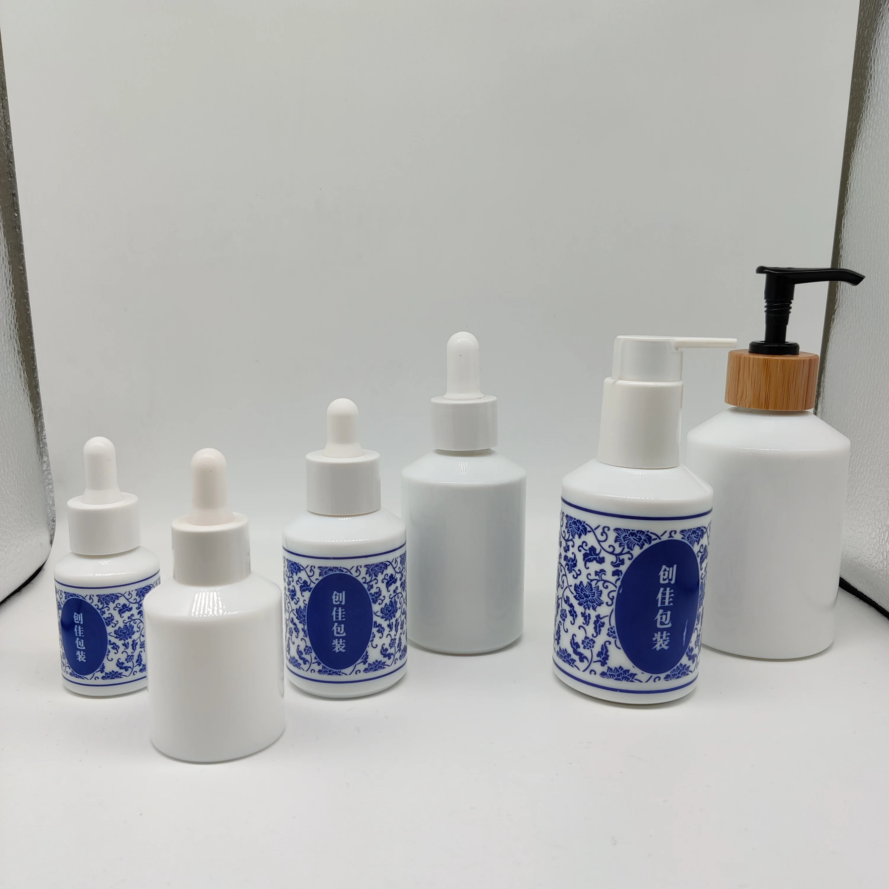 cosmetic packaging 30ml opal white essential oil glass bottle with natural wood dropper