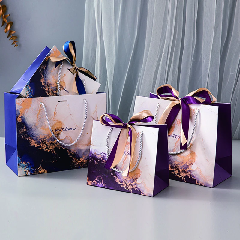 Wholesale Luxury Bulk Square Bottom White Cardboard Offset Printing Clothing Jewelry Paper Gift Bags with Ribbon Bow and Handles