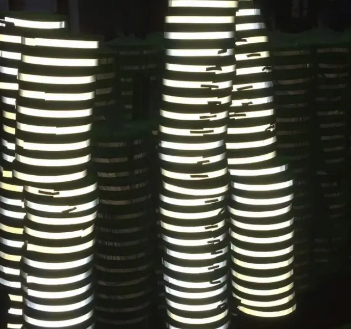 Wholesale dark colored fire resistant mylar reflective printing material yellow fabric light reflecting fabrics by the yard