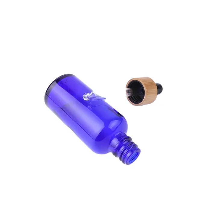 Hot Sale 10ml 15ml 20ml 30ml 50ml 100ml Amber Clear Blue Glass Dropper Bottle With Bamboo Cap And Glass Pipette