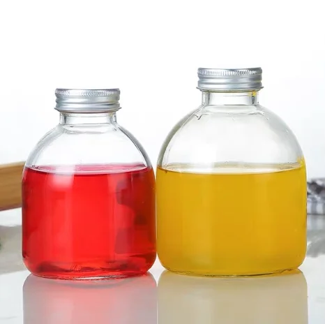 
300 ml 500 ml glass bottle of fruit juice in a round glass bottle with a lid 