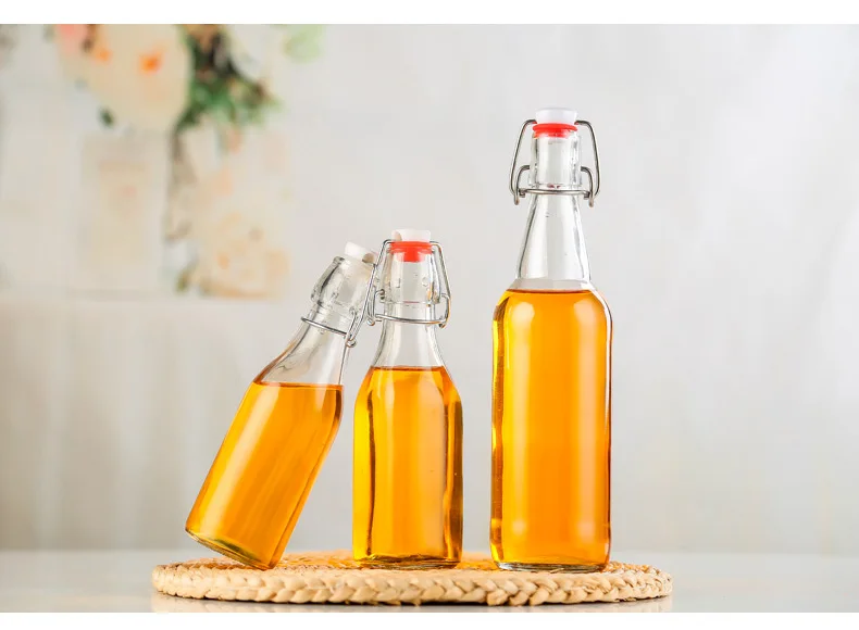 Custom Clear 500ml 750ml 1L bordeaux flat bottom swing top lid beverage beer glass wine bottle with airtight clip stopper