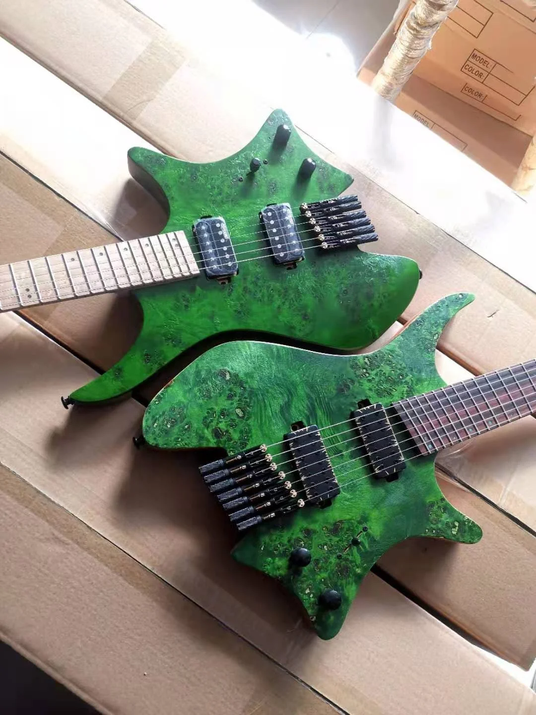 New Style whole sell headless electric guitar 7 string mahogany body burl top 5 pieces mahogany  neck factory outlet