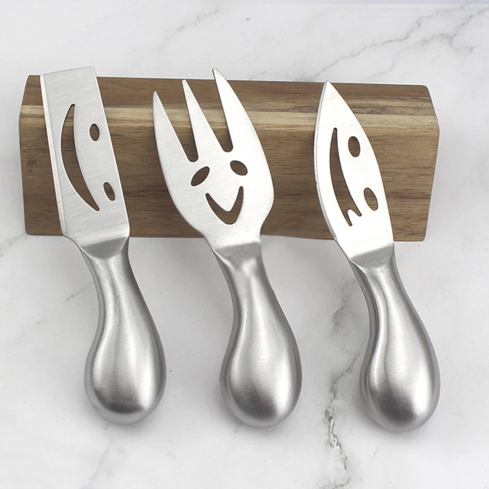 Our factory direct selling 4piece 2Cr14 stainless steel smiling face cream cheese knife hollow handle