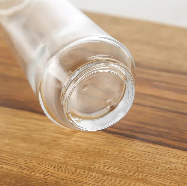 Luxury cosmetic packaging container clear glass packaging bottle with carved cover