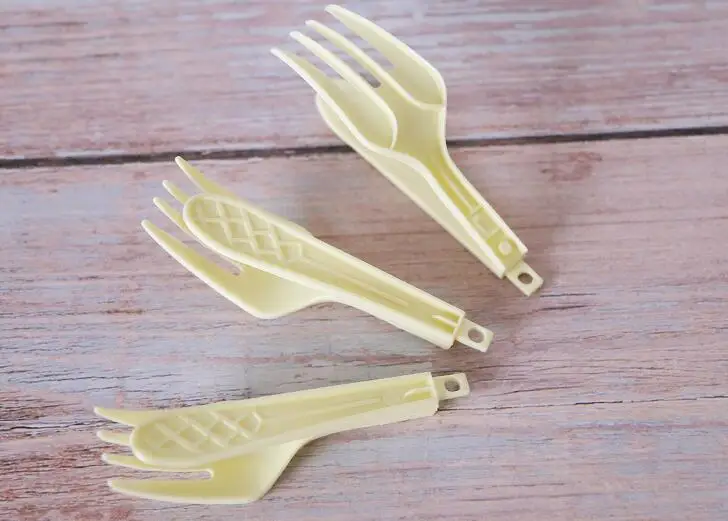 Disposable folding plastic fork and spoon spork