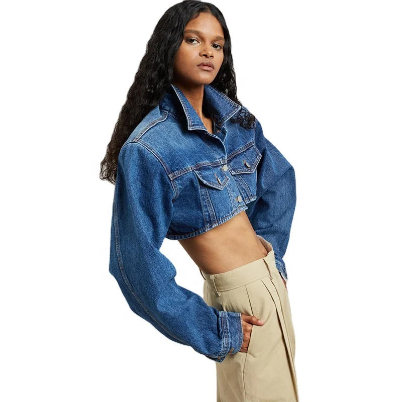 Dark Indigo Lightweight cotton denim Highly cropped profile Padded shoulders Flap front pockets Button front closure Denim jack