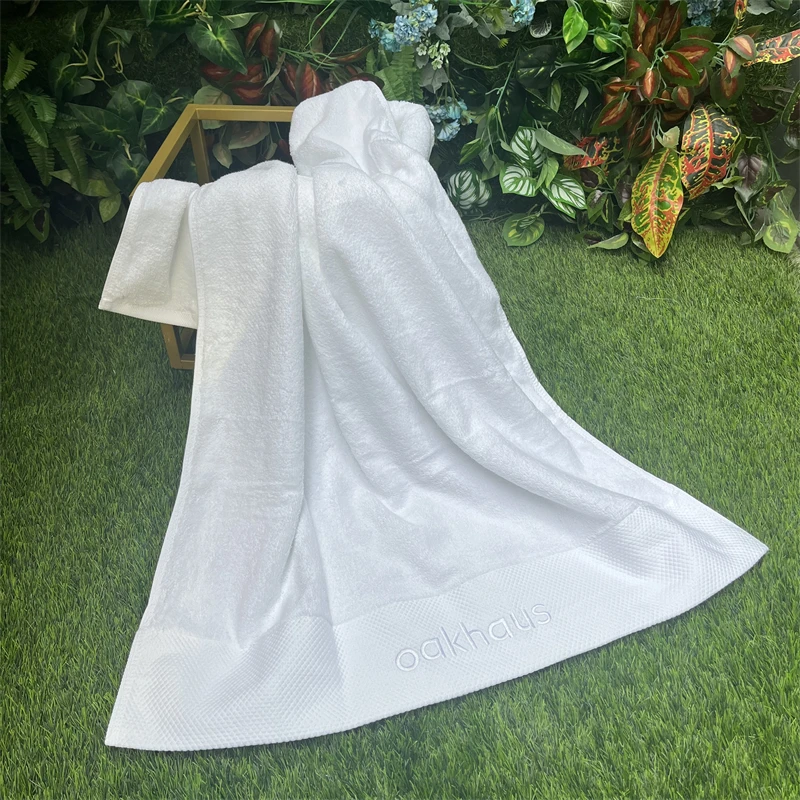 Высокое впитываемость 600 г белое тяжелое GSM Хлопковое полотенце 70x140 Фирменное