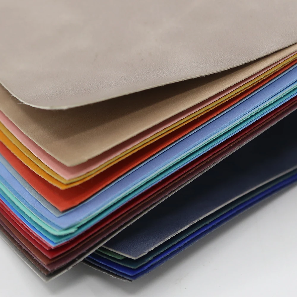 Custom Printing Color Change 0.7mm Nonwoven Coagulated Emobssing Waterproof PU Leather Fabric For Notebook Jean Label