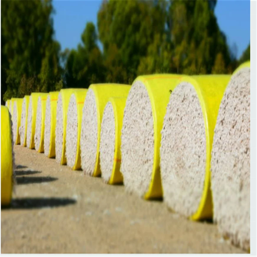 Yellow harvested cotton bales wrapped films