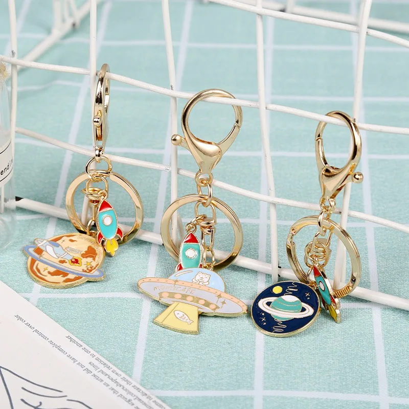 Wholesale Cute Cartoon Students Metal Keychain Bag Car Key Pendant Alloy Universe Starry Sky Rocket Astronaut Keychain