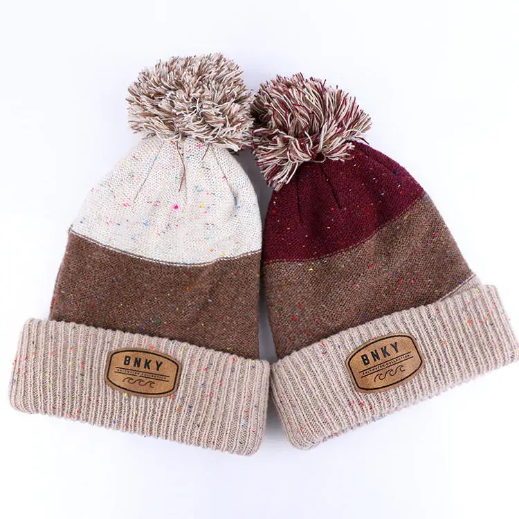 Qianzun manufacturer custom winter chunky speckle yarn block cuff pom pom beanie with leather patch
