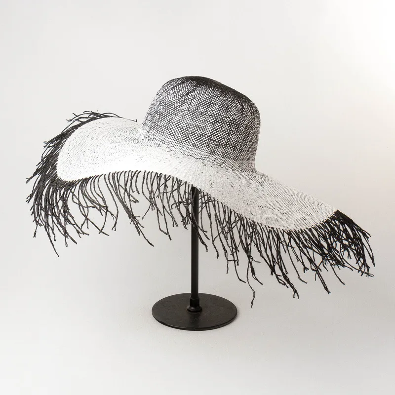 
European and American spring and summer new hairy dome paper straw hat fashion women large brimmed hat beach straw visor 