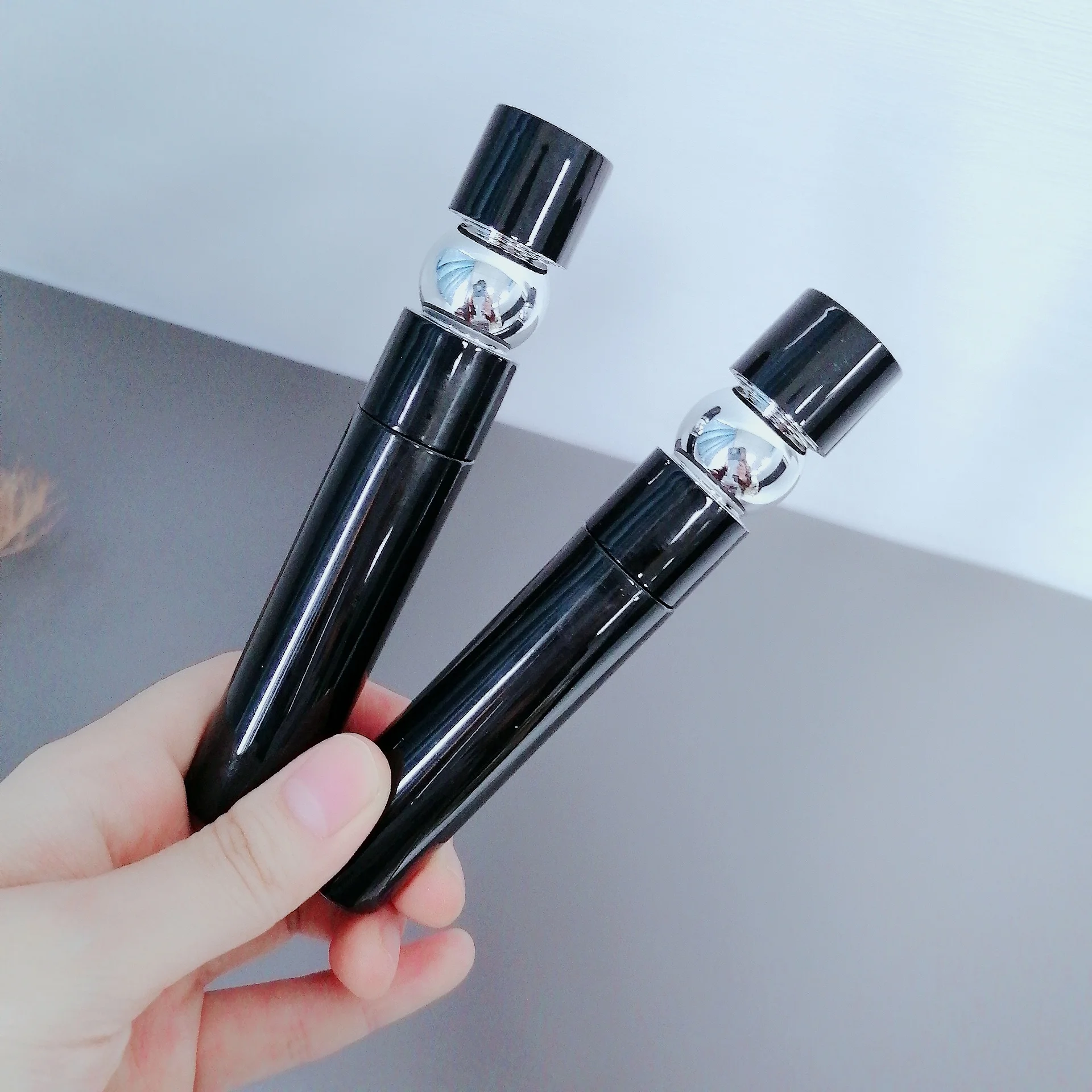 Hot sale new custom lip gloss tubes famous brand cosmetics packaging containers round black eyelash tube empty mascara tubes