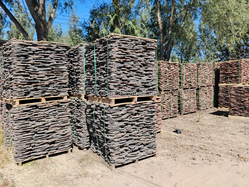 Natural red volcanic lava rock slate stone for pavement roads and wall cladding and floor patios loose lava stone slate