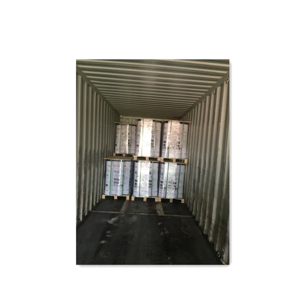 ASTM Asphalt Paper Rolling out the asphalt saturated felt paper in line with the drip edge